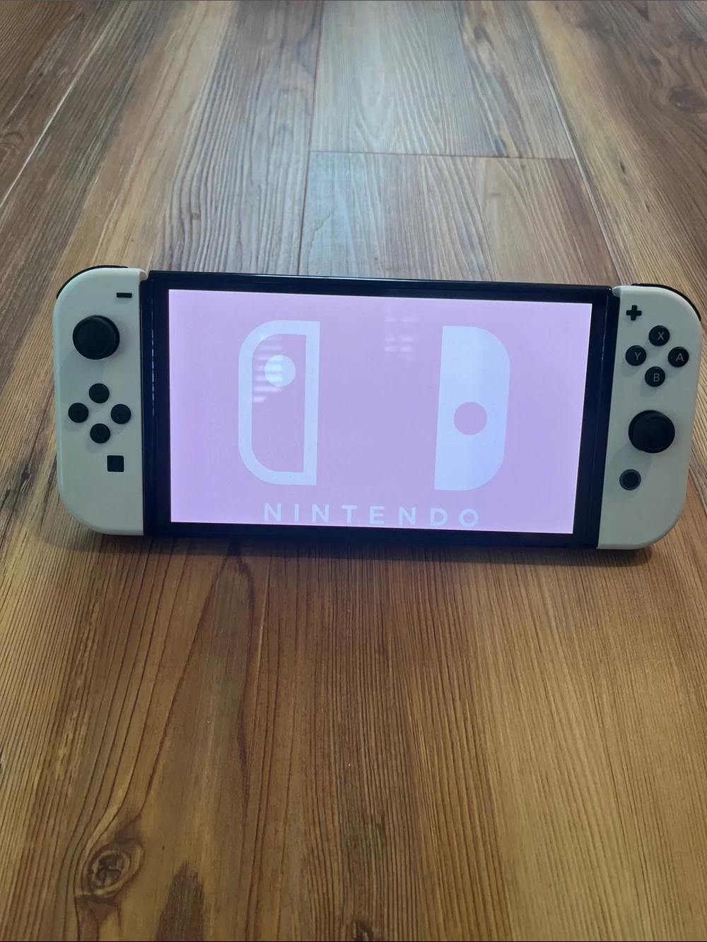 Nintendo Switch OLED Console with White Joy-Con Controllers Bundle